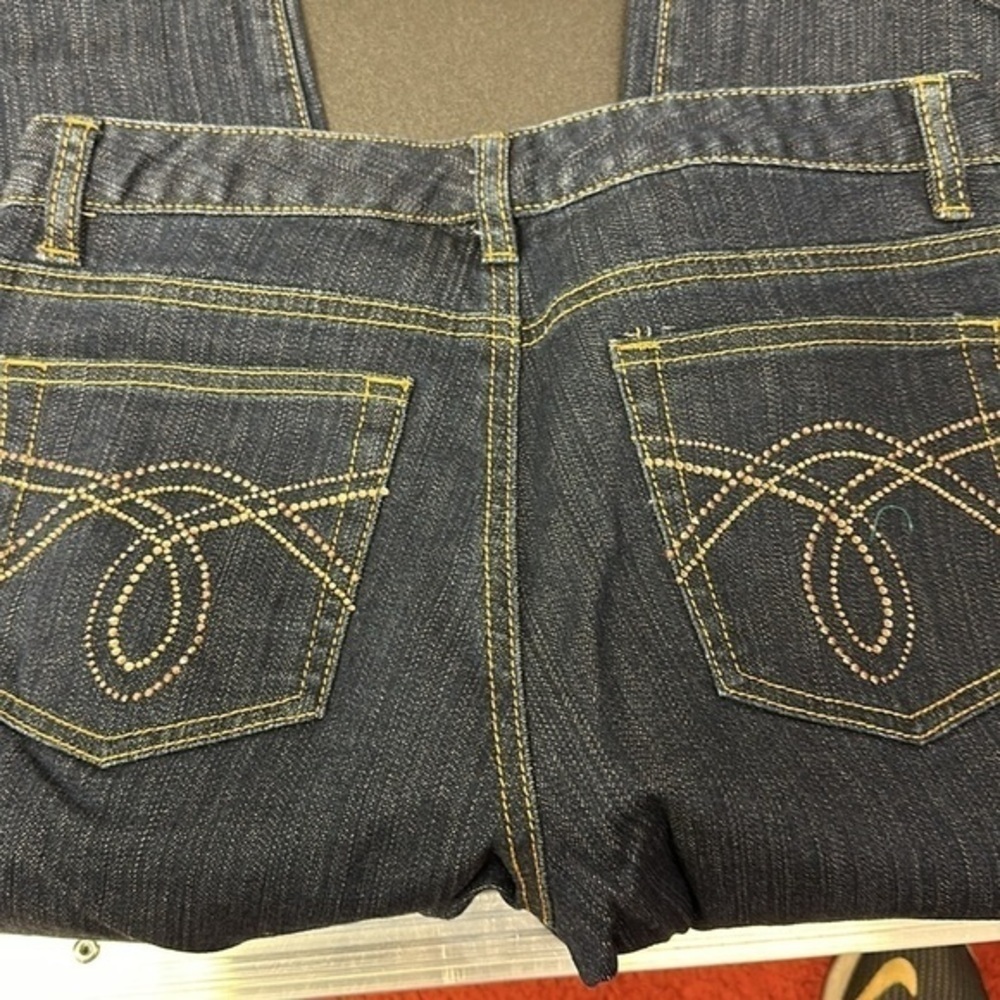 94.  Michael Kors dark blue skinny jeans with embellished pockets size 4